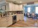Bright and open kitchen featuring stainless steel appliances and a view into the dining area at 710 Oxford Crest Ct, Lawrenceville, GA 30043