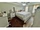 Comfortable bedroom showcasing a bed with white linens and ample natural light from the windows at 710 Oxford Crest Ct, Lawrenceville, GA 30043