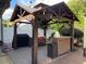 Outdoor kitchen complete with grill, bar, and storage for ultimate outdoor entertaining at 710 Oxford Crest Ct, Lawrenceville, GA 30043