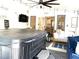 Enclosed patio featuring a hot tub, a television, and a seating area at 710 Oxford Crest Ct, Lawrenceville, GA 30043