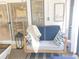 Comfortable porch swing with pillows and blanket to sit and enjoy time outdoors at 710 Oxford Crest Ct, Lawrenceville, GA 30043