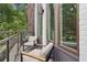 Relaxing balcony with outdoor seating and views of the surrounding trees at 1251 Chelsea Nw Cir # 30, Atlanta, GA 30318