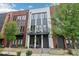 Charming townhome featuring brick accents, a balcony, and modern design elements for stylish urban living at 1251 Chelsea Nw Cir # 30, Atlanta, GA 30318