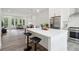 Modern kitchen features a large island with seating and stainless steel appliances at 1251 Chelsea Nw Cir # 30, Atlanta, GA 30318