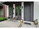 Inviting front porch with contemporary seating, sleek planters, and a modern entrance door at 1251 Chelsea Nw Cir # 30, Atlanta, GA 30318