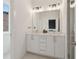 Modern bathroom featuring a double vanity with white countertops and ample lighting at 1251 Chelsea Nw Cir, Atlanta, GA 30318