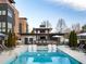 Stunning community pool featuring a modern bar and lounge area with comfortable seating and pristine blue water at 1251 Chelsea Nw Cir, Atlanta, GA 30318