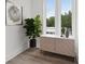 Cozy entryway nook with cabinet, decorative plant, and natural light, creating a welcoming atmosphere at 1251 Chelsea Nw Cir, Atlanta, GA 30318