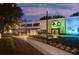 Exterior of The Third Spot venue featuring a green color scheme, modern design and outdoor seating at 1251 Chelsea Nw Cir, Atlanta, GA 30318