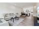 Open-concept living area with hardwood floors, a comfortable sofa, and ample natural light at 1251 Chelsea Nw Cir, Atlanta, GA 30318
