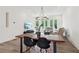 Open-concept living space with dining area, comfortable seating, and large windows for ample natural light at 1251 Chelsea Nw Cir, Atlanta, GA 30318