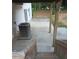 Exterior view of the home and backyard featuring concrete patio, and mature trees surrounding the property at 2775 Emerald Springs Dr, Lawrenceville, GA 30045
