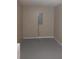 A finished basement with neutral paint and grey floors at 2775 Emerald Springs Dr, Lawrenceville, GA 30045