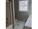 Bathroom featuring a shower, toilet, vanity, and window at 2775 Emerald Springs Dr, Lawrenceville, GA 30045