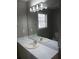 Bathroom with a white countertop, sink, mirror, and updated lighting at 2775 Emerald Springs Dr, Lawrenceville, GA 30045
