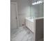 Bathroom features a white vanity with updated sink and faucet, and a large mirror at 2775 Emerald Springs Dr, Lawrenceville, GA 30045