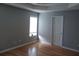 Bedroom featuring hardwood floors, a window, and neutral wall paint at 2775 Emerald Springs Dr, Lawrenceville, GA 30045