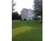 Exterior view of a two-story home with a green lawn and traditional siding in a suburban setting at 2775 Emerald Springs Dr, Lawrenceville, GA 30045