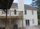 Multi-level deck with view of the exterior of the cream colored house at 2775 Emerald Springs Dr, Lawrenceville, GA 30045