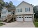 Traditional two-story home with brick accents, a two-car garage, and inviting entryway at 2775 Emerald Springs Dr, Lawrenceville, GA 30045