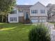Charming two-story home featuring a well-manicured lawn and a two-car garage at 2775 Emerald Springs Dr, Lawrenceville, GA 30045