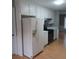 Clean kitchen featuring white appliances and plenty of cabinet space at 2775 Emerald Springs Dr, Lawrenceville, GA 30045