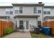 Cozy backyard featuring a concrete patio, privacy fence, and partial view of the home's rear exterior at 3829 Thayer Trce, Duluth, GA 30096