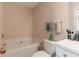 Bathroom featuring a soaking tub, toilet, and vanity at 3829 Thayer Trce, Duluth, GA 30096