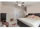 Bedroom featuring a bed, dresser, and white double doors at 3829 Thayer Trce, Duluth, GA 30096