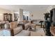 Open-concept living space with a comfortable seating area and dining space in the background at 3829 Thayer Trce, Duluth, GA 30096