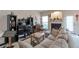 Comfortable living room with fireplace, neutral carpet, plenty of seating, and lots of natural light at 3829 Thayer Trce, Duluth, GA 30096