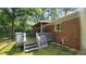 Wooden deck on a brick home features a cozy space for relaxation and entertaining guests at 766 Virginia Cir, Forest Park, GA 30297