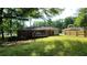 Spacious backyard with a small deck, offering plenty of room for outdoor activities at 766 Virginia Cir, Forest Park, GA 30297