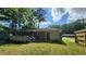 Back of house features a sliding door to a deck and ample yard space for entertaining at 766 Virginia Cir, Forest Park, GA 30297