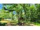 Backyard features an outbuilding and lots of mature trees for shady privacy at 766 Virginia Cir, Forest Park, GA 30297