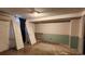 Unfinished basement ready for new flooring and walls with open studs and exposed wiring at 766 Virginia Cir, Forest Park, GA 30297