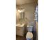 Bathroom featuring a vanity sink, mirror, and toilet with a neutral color scheme at 766 Virginia Cir, Forest Park, GA 30297