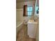 Bathroom featuring a tub, toilet, and vanity sink and window with natural light at 766 Virginia Cir, Forest Park, GA 30297