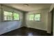 Bedroom featuring hardwood floors, two large windows offering great views at 766 Virginia Cir, Forest Park, GA 30297
