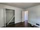 Bedroom featuring hardwood floors, large closet, and door to another room at 766 Virginia Cir, Forest Park, GA 30297