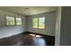 Bedroom with hardwood floors and large windows providing great natural light at 766 Virginia Cir, Forest Park, GA 30297