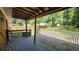 Inviting covered deck, perfect for outdoor relaxation and enjoying backyard views at 766 Virginia Cir, Forest Park, GA 30297