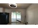 Bright kitchen featuring sliding glass doors to back deck, and modern lighting fixture at 766 Virginia Cir, Forest Park, GA 30297