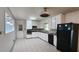 Functional kitchen with white cabinetry and black appliances at 766 Virginia Cir, Forest Park, GA 30297