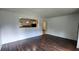 Spacious living room showcasing hardwood floors, open layout to the kitchen at 766 Virginia Cir, Forest Park, GA 30297