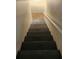 Staircase leading to the lower level of the home with a white railing at 766 Virginia Cir, Forest Park, GA 30297