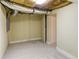 Unfinished basement with carpet, exposed ceiling insulation and ductwork at 256 Indian Trl, Marietta, GA 30068