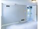 Finished basement space with neutral walls and ceiling and an open door to another area at 256 Indian Trl, Marietta, GA 30068