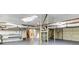 Unfinished basement featuring exposed ductwork, painted support beams, and concrete floors at 256 Indian Trl, Marietta, GA 30068
