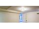 A bright basement featuring white walls, neutral carpeting, and a doorway leading to another part of the basement at 256 Indian Trl, Marietta, GA 30068